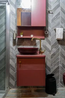 a bathroom with a red sink and a mirror at Mercan Apartments Balat-The Hidden Terrace in Istanbul
