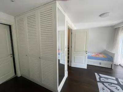 a bedroom with a closet and a bed in it at Villa Orange in Istanbul