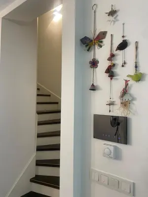 a room with a staircase with a wall with windmills at Villa Orange in Istanbul