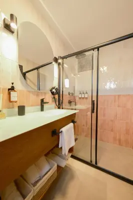 a bathroom with a sink and a shower at Pastel İstanbul in Istanbul