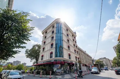 a tall white building on a city street at 216 Star in Samandra