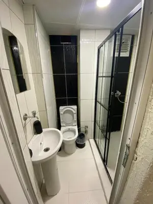 a small bathroom with a toilet and a sink at Poyraz suit in Bursa