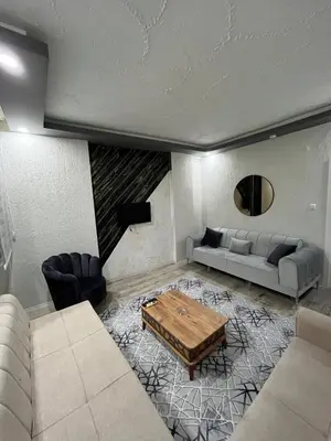 a living room with a couch and a coffee table at Suit 2 in Bursa