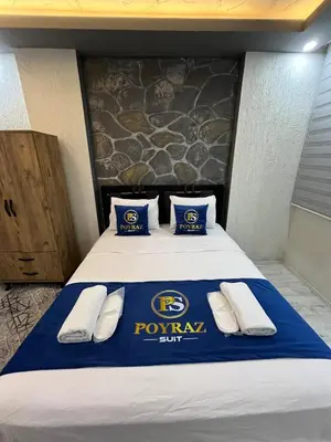 a hotel room with a pep rally sign on the bed at Suit 2 in Bursa