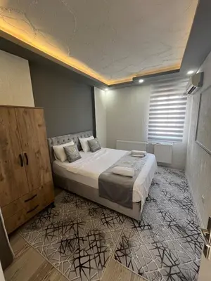 a bedroom with a large bed in a room at Suit 4 in Bursa