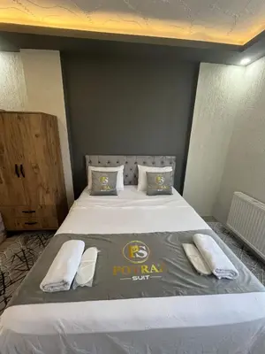 a bedroom with a bed with a football themed blanket at Suit 4 in Bursa