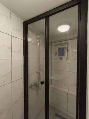 a shower with a glass door in a bathroom at White Lotus Suites in Istanbul