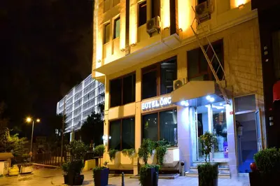 a building with a sign on it at night at Hotel Öncü in Istanbul