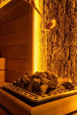 a fireplace with a pile of rocks in it at Wellwood Otel in Sapanca