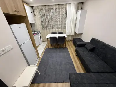 a living room with a couch and a table at Galata Green Apple Apart in Istanbul
