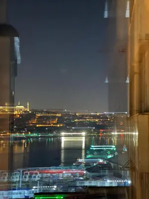 a view of a river and a city at night at Galata Green Apple Apart in Istanbul