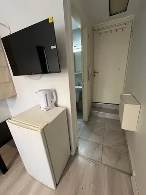 a room with a tv on the wall at Şişli Suites - Room45 in Istanbul