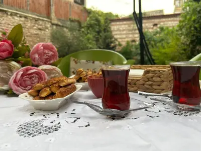 a table with a plate of food and two glasses at Welcome to the presence of history! in Istanbul