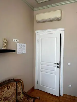 a white door in a room with a fan at Welcome to the presence of history! in Istanbul