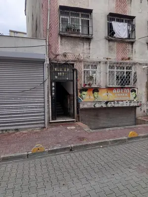 a building with a door open on a street at Hilal Aparment Basement in Istanbul