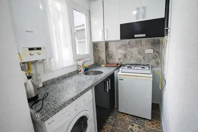 a small kitchen with a stove and a sink at Ayasofya Bella Vista APART in Istanbul
