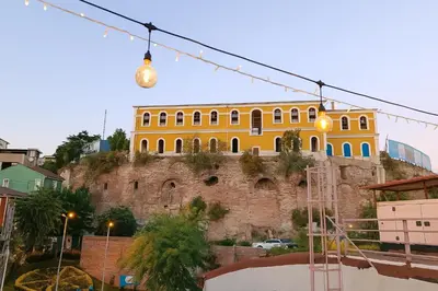 a yellow building on the side of a hill at Ayasofya Bella Vista APART in Istanbul