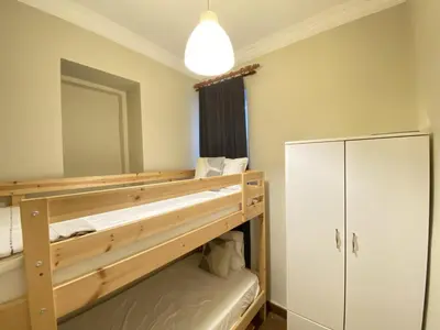 a bedroom with a bunk bed and a mirror at Charming Vintage 3BR in the Heart of Beyoğlu in Istanbul