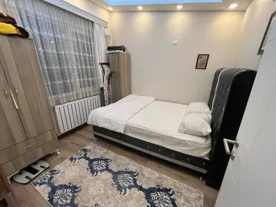 a small bedroom with a bed and a window at Mutlu flat in Istanbul