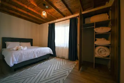 a bedroom with a bed and a window at ayrıkvadi panorama in Serdivan