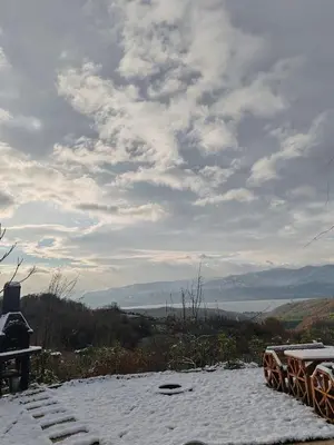 a snow covered roof with a view of a valley at ayrıkvadi panorama in Serdivan