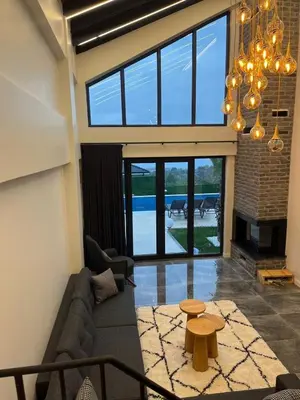 a living room with a couch and a table at Sapanca modern in Sapanca
