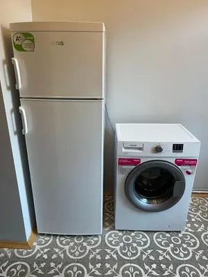 a refrigerator and a washing machine in a room at Ozcans Pera Flats 2 in Istanbul