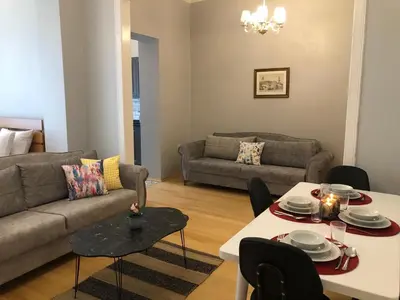 a living room with a couch and a table at Ozcans Pera Flats 2 in Istanbul