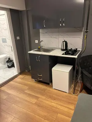a small kitchen with a sink and a stove at Besiktas Guest House in Istanbul