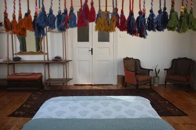 a room with a bed and a bunch of umbrellas at Stunning 5 Bedroom Sunlit Apartment Galata in Istanbul