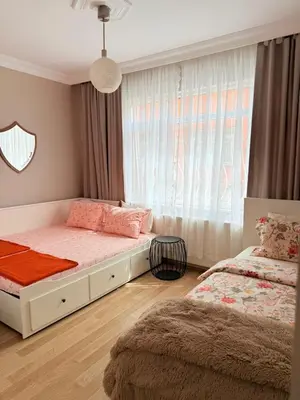 a bedroom with two beds and a window at sultans corner in Istanbul