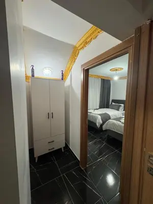 a bedroom with a bed and a mirror at Grand Süleymaniye Hotel in Istanbul