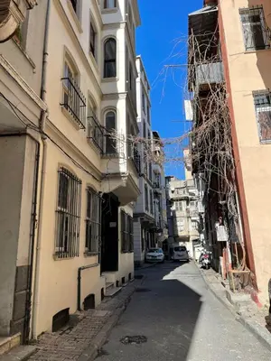 an alley in the city with buildings at Ozcans Pera Flats 3 in Istanbul