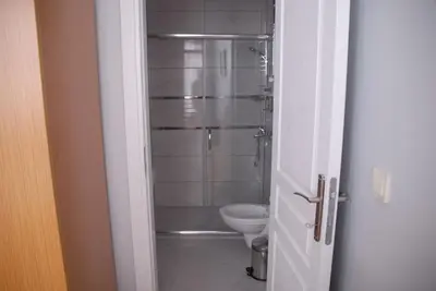 a bathroom with a shower and a toilet at Ozcans Pera Flats 3 in Istanbul