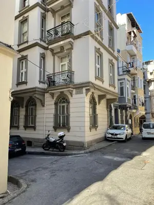 a motorcycle parked in front of a building at Ozcans Pera Flats 3 in Istanbul