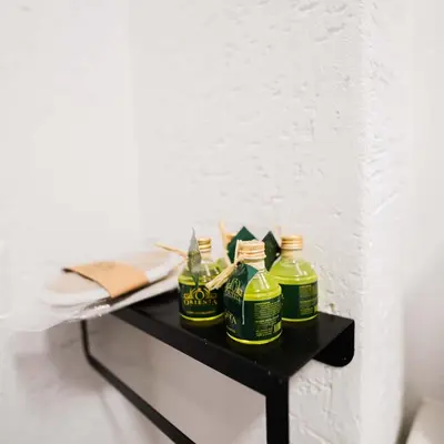 a black table with three bottles on it at Modern apartment in the center of Kadıköy in Istanbul