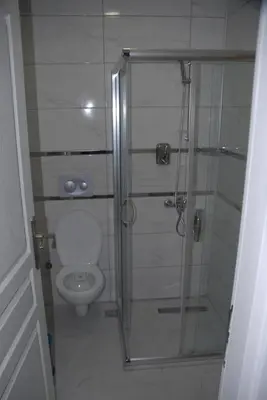 a bathroom with a shower and a toilet at Ozcans Pera Flats 8 in Istanbul