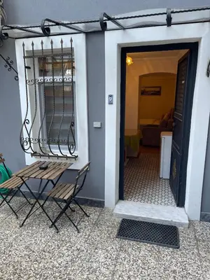 a door to a room with a chair next to it at Ozcans Pera Flats 9 in Istanbul
