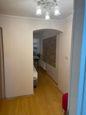 a room with a ceiling fan and a brick wall at Ozcans Pera Flats 9 in Istanbul