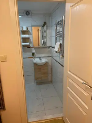 a bathroom with a sink and a mirror at Ozcans Pera Flats 9 in Istanbul