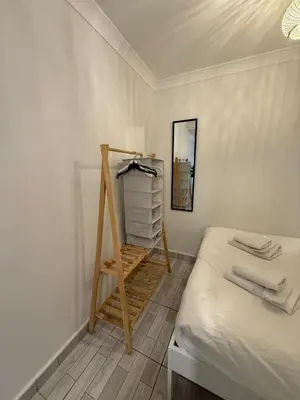 a room with a bed and a ladder and a mirror at Şişli Suites - Room41 in Istanbul