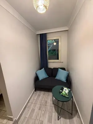 a living room with a couch and a table at Şişli Suites - Room41 in Istanbul