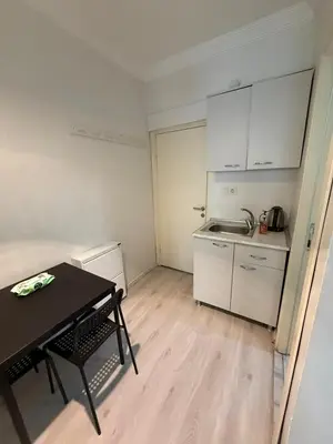 a small kitchen with a table and a table and a table at Şişli Suites - Room26 in Istanbul