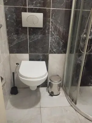 a bathroom with a toilet and a shower at Şişli Suites - Room47 in Istanbul