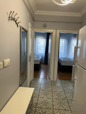 a hallway with a room with a bedroom at Ozcans Sururi Pera Flats 2 in Istanbul