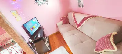 a living room with a couch and a flat screen tv at Sweet Home Kadikoy in Istanbul