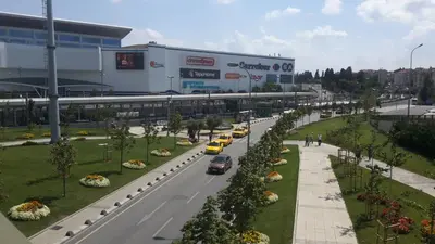 a street with cars driving down a road in front of a building at Sweet Home Kadikoy in Istanbul