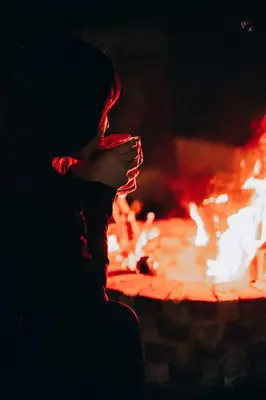a person standing in front of a fire pit at Hilltop Bungalov Sapanca 3 in Sapanca