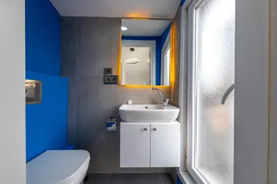 a bathroom with a white sink and a toilet at Nine Rooms by taksim in Istanbul