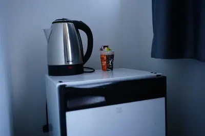 a coffee pot on top of a refrigerator at Kuyu Apartments near taksim in Istanbul